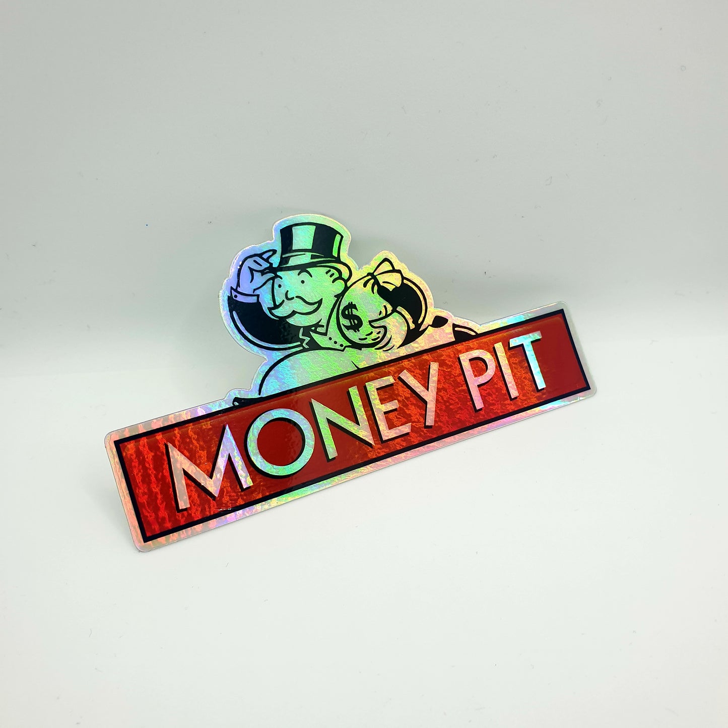 HOLOGRAPHIC MONEY PIT STICKER